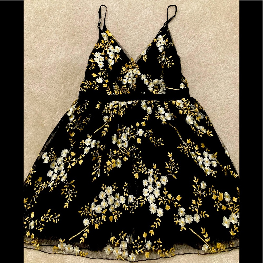 Gold and black lace dress.